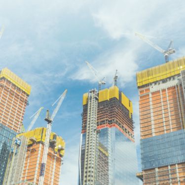 A group of city buildings being built